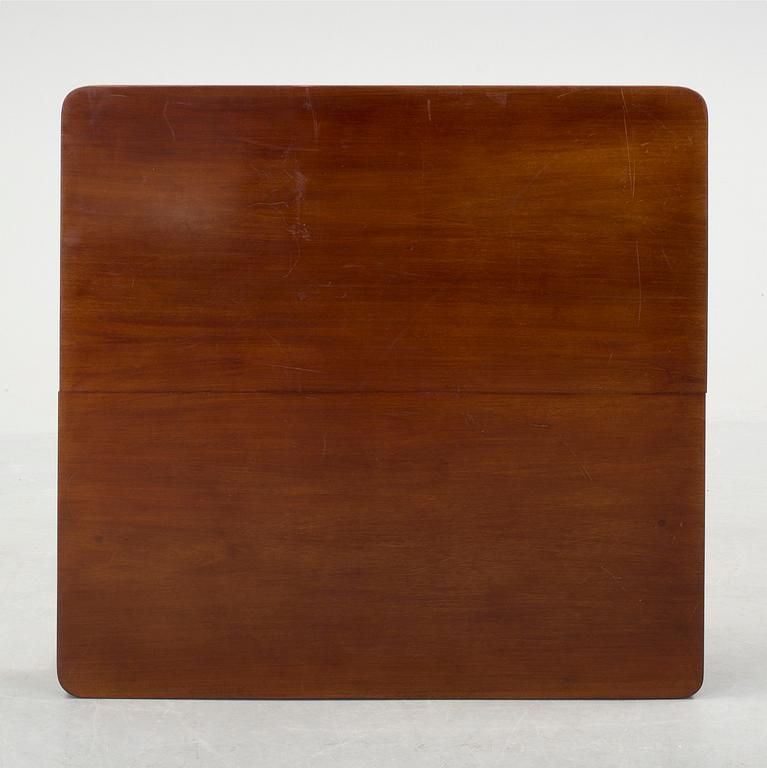 A mid 20th century mahogany veneered table from Nordiska Kompaniet (NK).