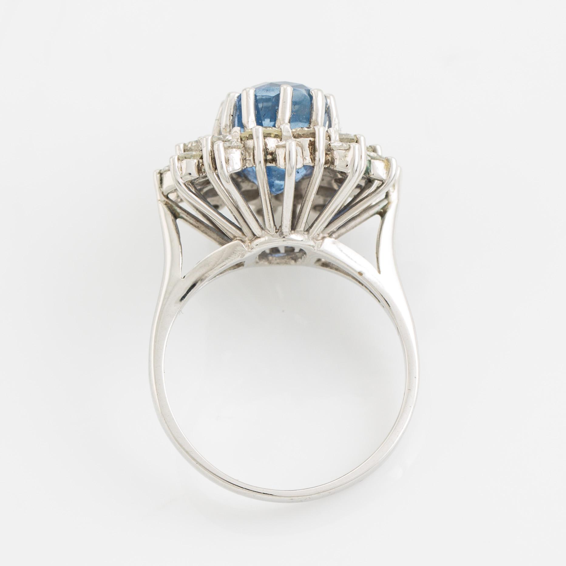 Sapphire and brilliant cut diamond cluster ring.