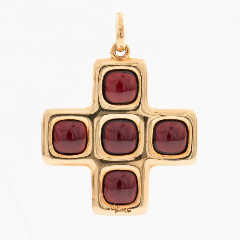 An 18K gold and garnet Pomellato cross.