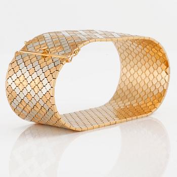 An tricolor gold bracelet from Uno A Erre in Arezzo in Italy.