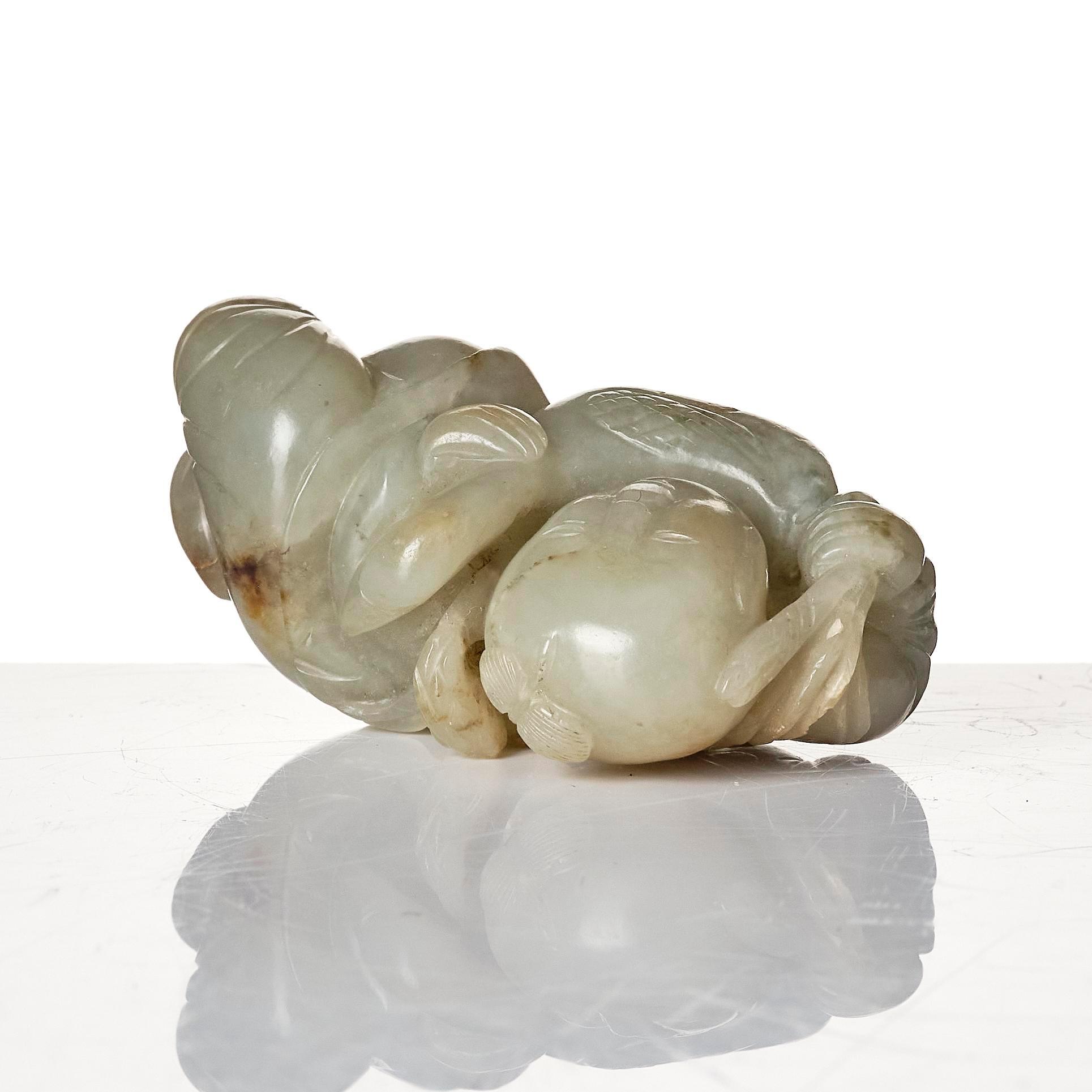 Two archers rings and two nephrite carvings.
