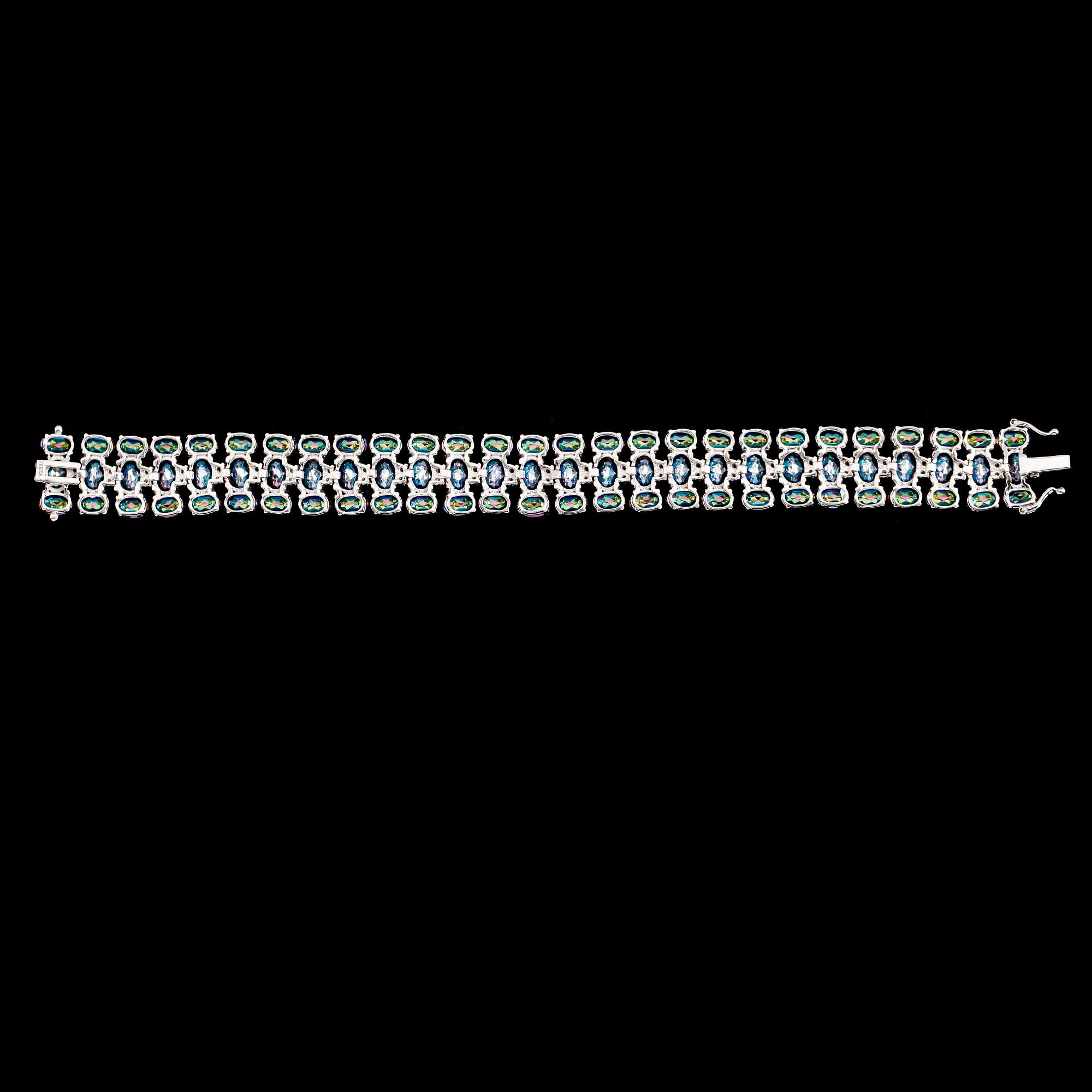 ARMBAND, sterlingsilver, vita topaser tot ca 0.50 ct, färgade topaser tot ca 48.00 ct.