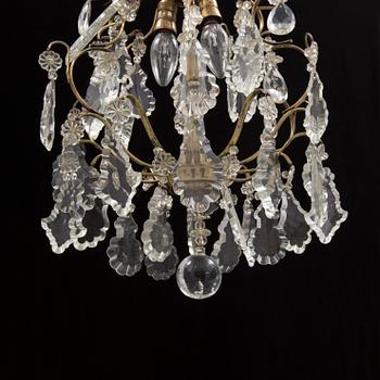 A BAROQUE STYLE CEILING LIGHT, first half of the 20th century. Height ca 45 cm.