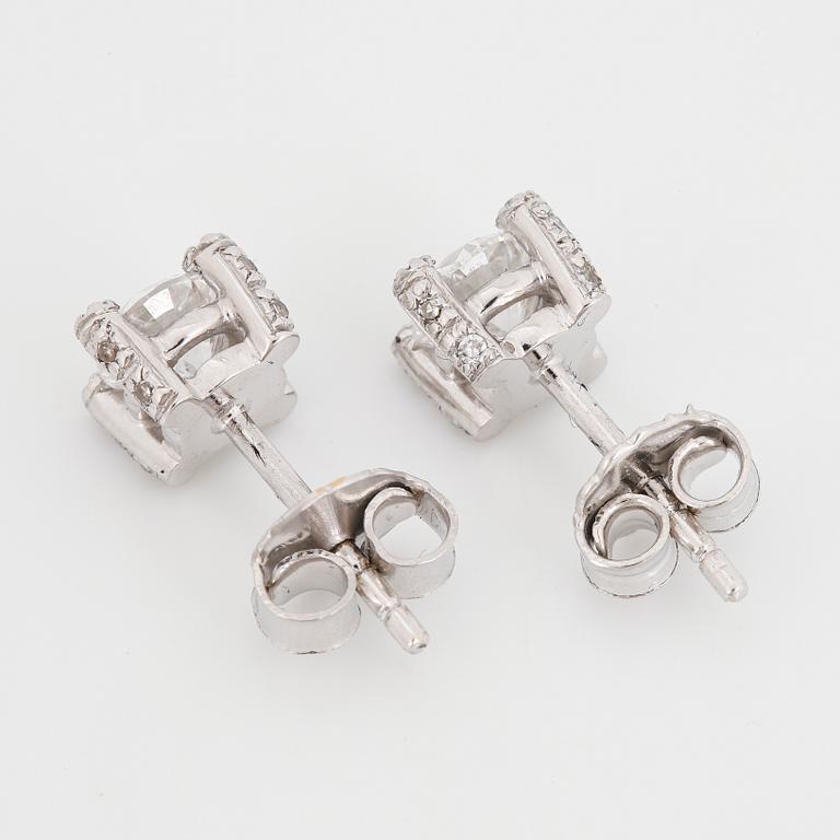 Brilliant-cut diamond stud earrings.