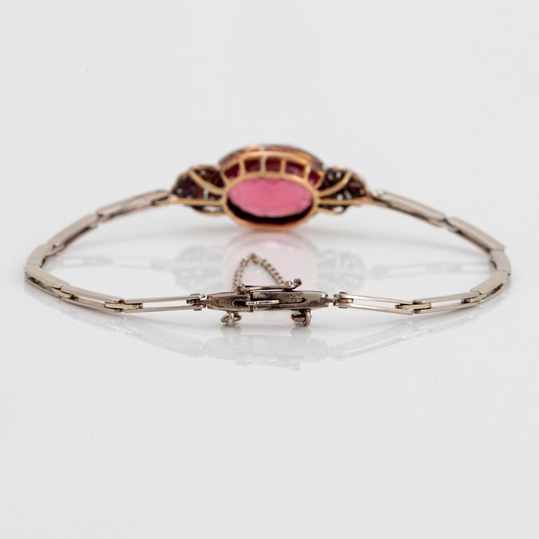 An 18K gold bracelet set with a faceted pink tourmaline weight ca 6.00 cts.