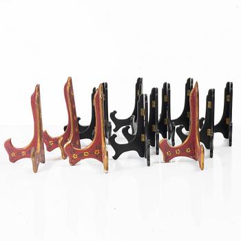 A group lot of 13 Chinese wooden stands, 20th century.