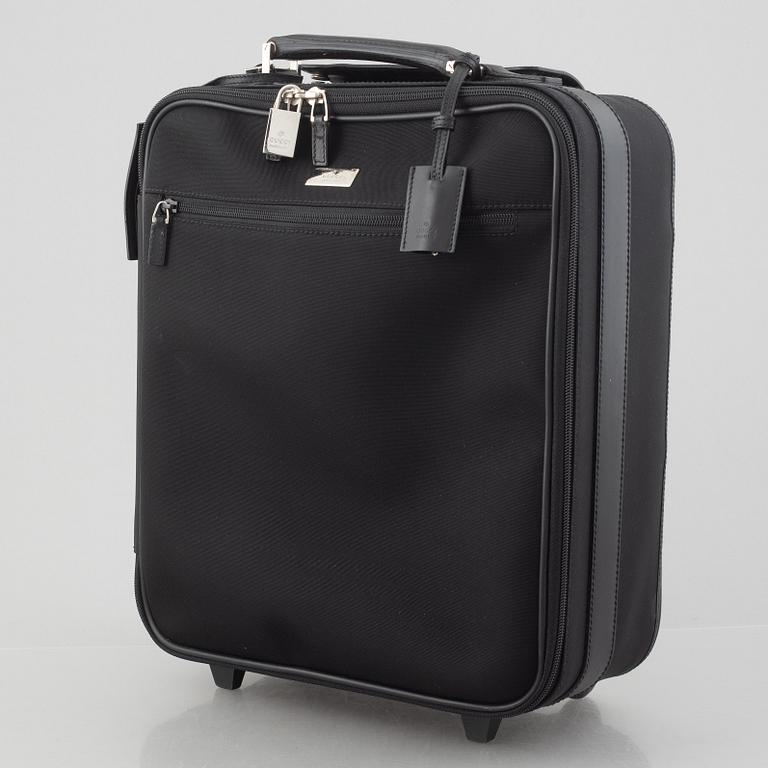 Gucci, suitcase/cabin bag.