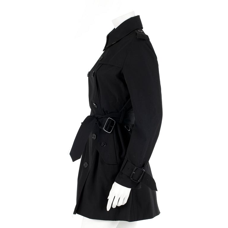 BURBERRY, a black cottonblend ladies trenchcoat. UK size 10.