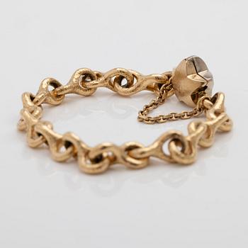 Armband 18K guld med en diamant.