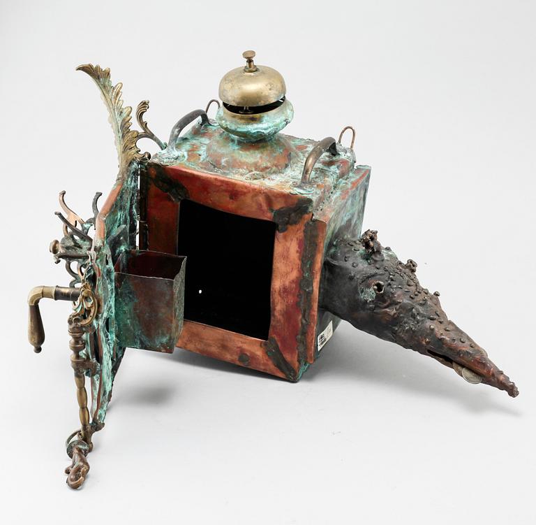 a metal sculpture, signed.