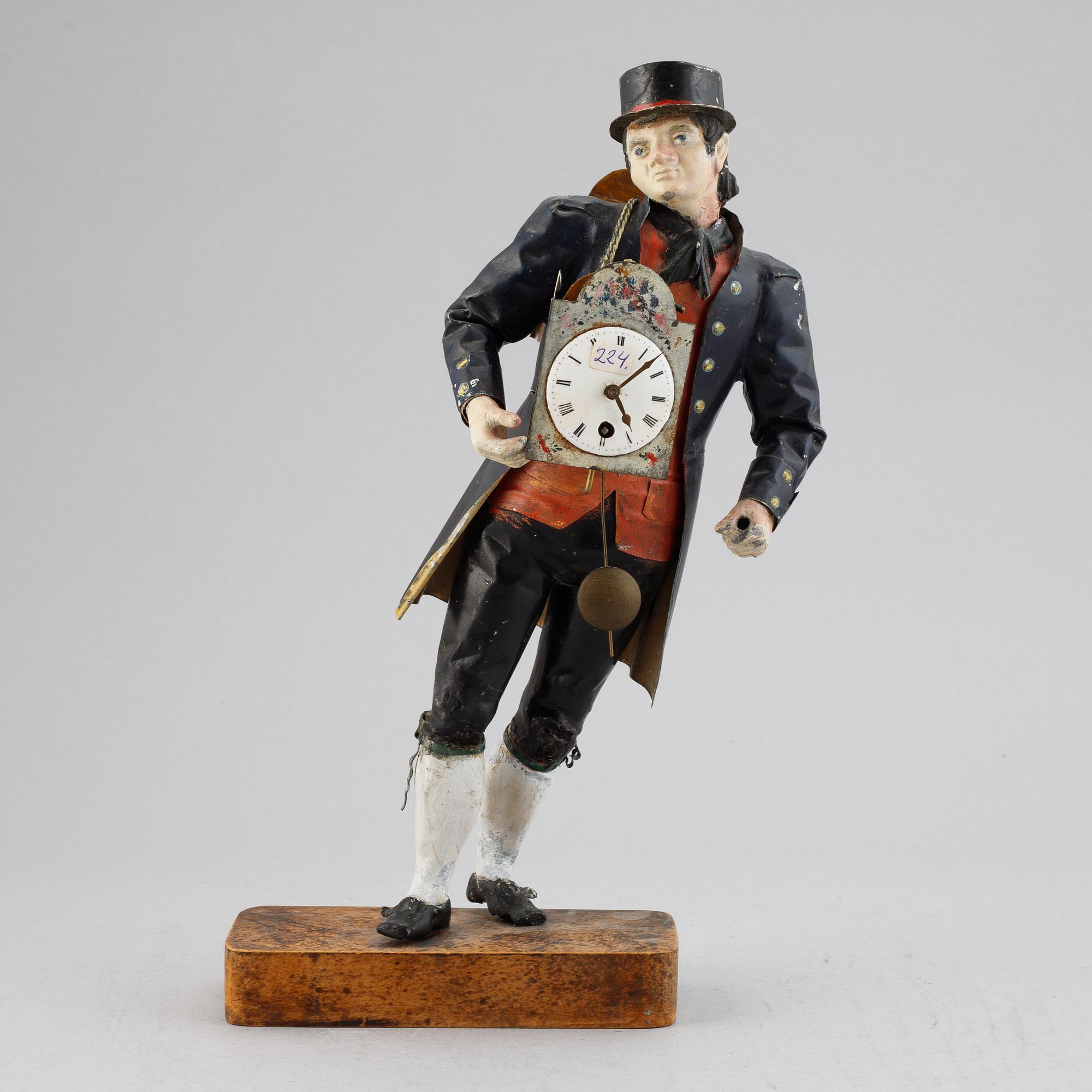 A Black Forest sheet metal figural timepiece, second half of the 19th century.