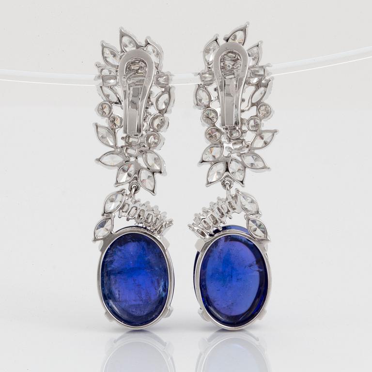 A pair of 18K gold tanzanite earings set with diamonds of various shapes.