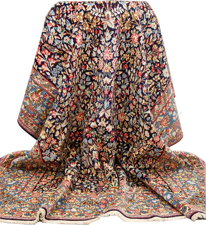 A pictoral 'Millefleur' Kerman carpet, c 340 x 240 cm.