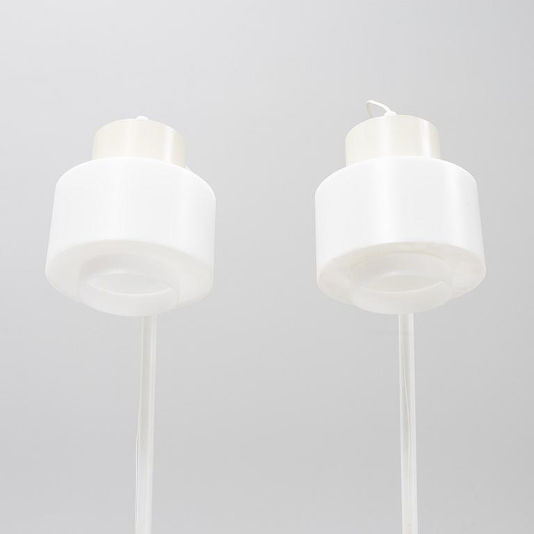 A pair of whithe floor lights, Luxus, Vittsjö.
