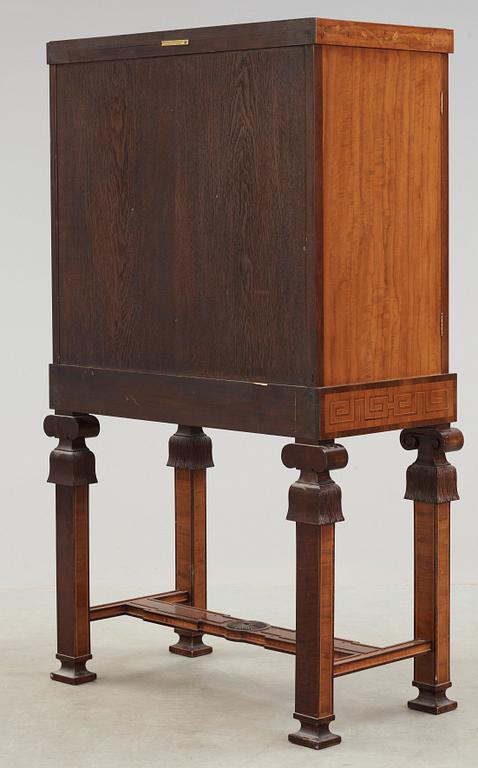 An Erik Matsson marquetry cabinet on stand, Carl Johansson Möblering AB, Stockholm 1932.