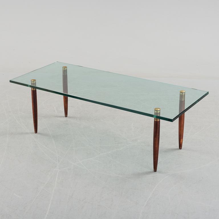 A 1960's glass sofa table.