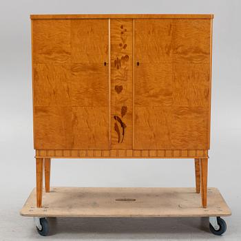 A birch wood veneered cabinet, first half of the 20th Century.