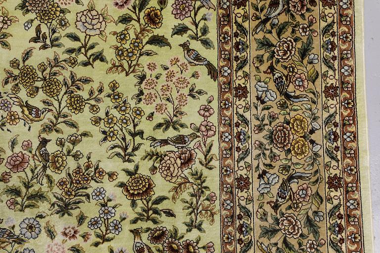 An Oriental silk rug, approx. 124 x 183 cm.