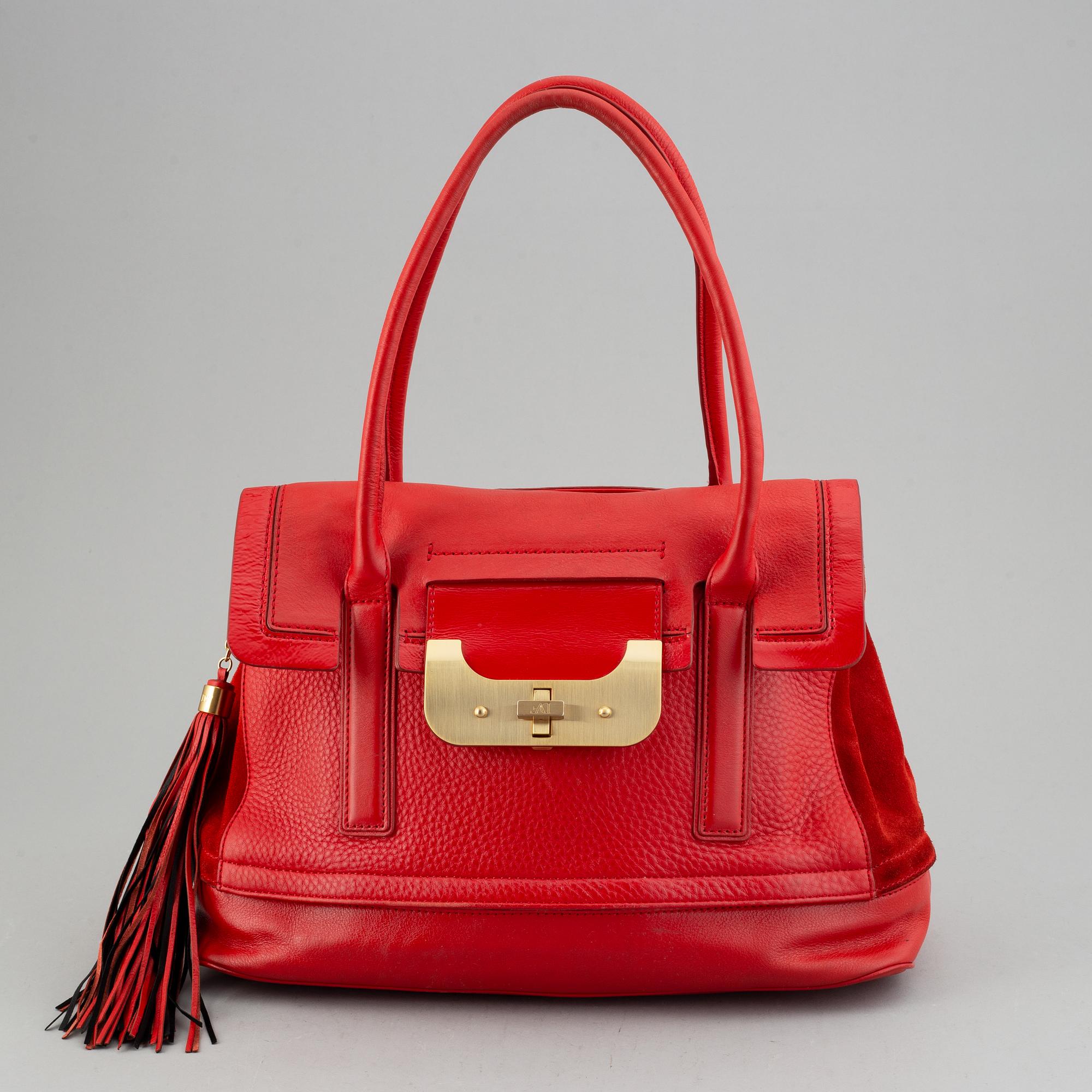 Diane von Fürstenberg a red leather handbag and wallet.