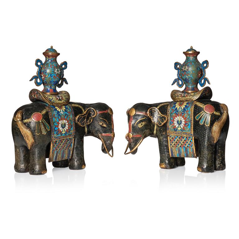 A pair of Chinese cloisonné and chamleve caparisoned elephants, Qing dynasty, 18th/19th Century.