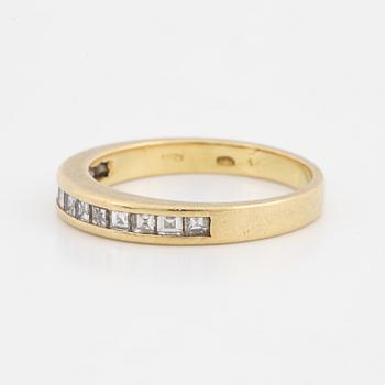 Step-cut diamond ring.
