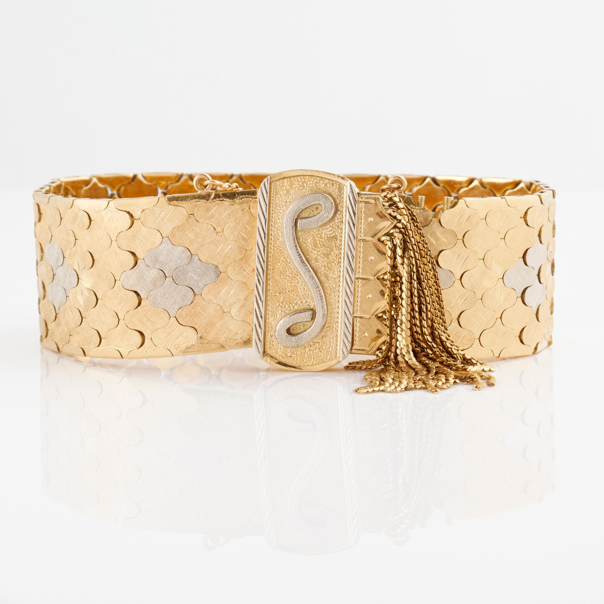 An tricolor gold bracelet with Italian hallmarks.