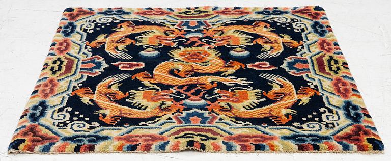 A Chinese small square rug, semi-antique, 65 x 68 cm.
