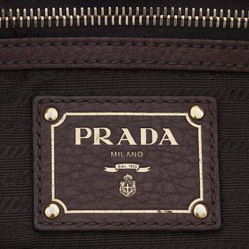 PRADA, a brown leather shoulder bag.