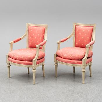 A pair of gustavian style armchairs, second half of the 20th century.