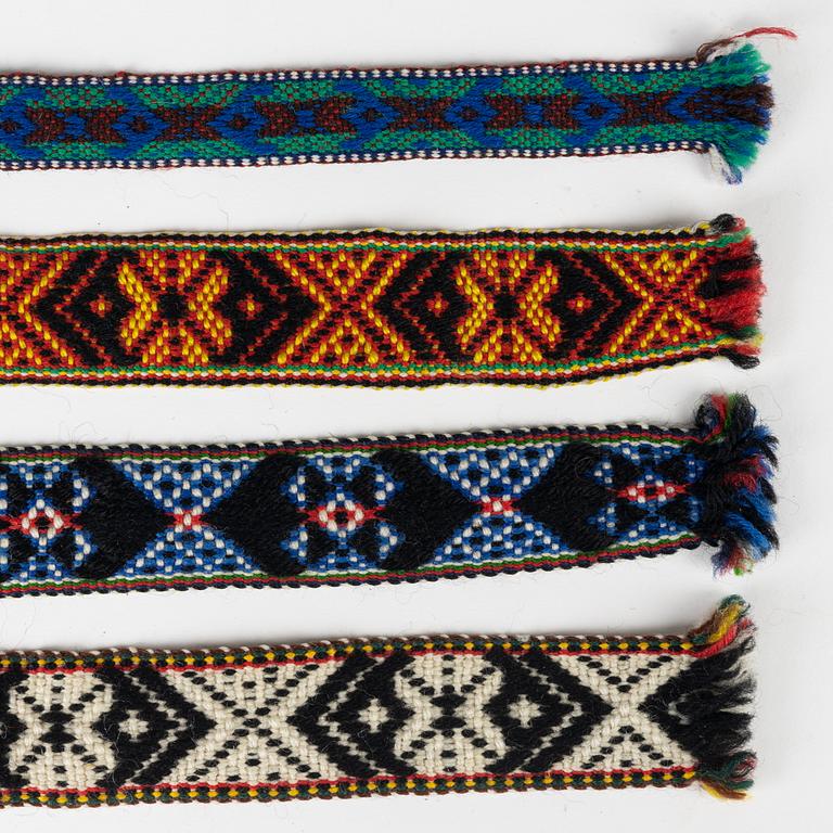 Twelve woven multicoloured bands, 20th Century.