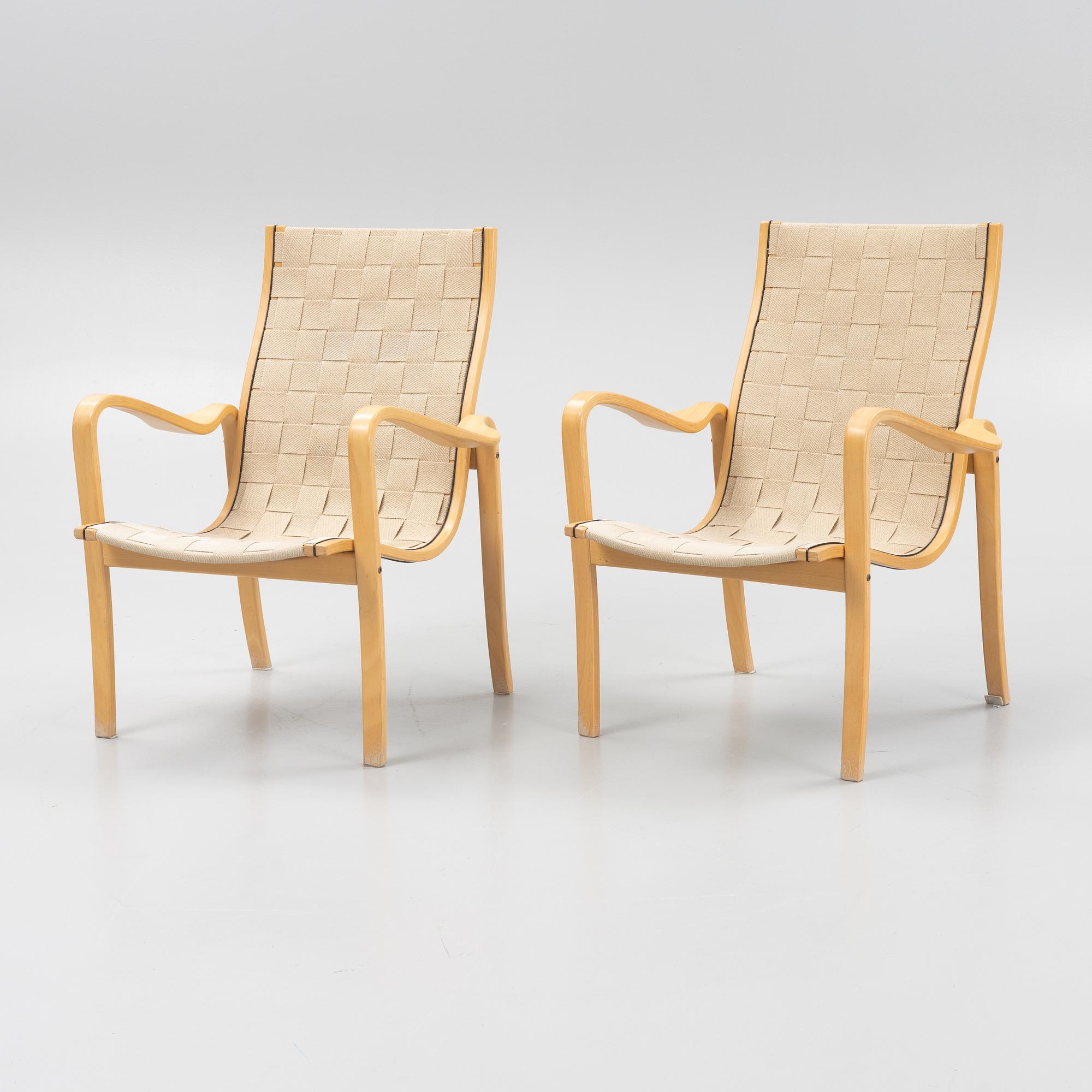 A pair of lounge chairs from Källemo.