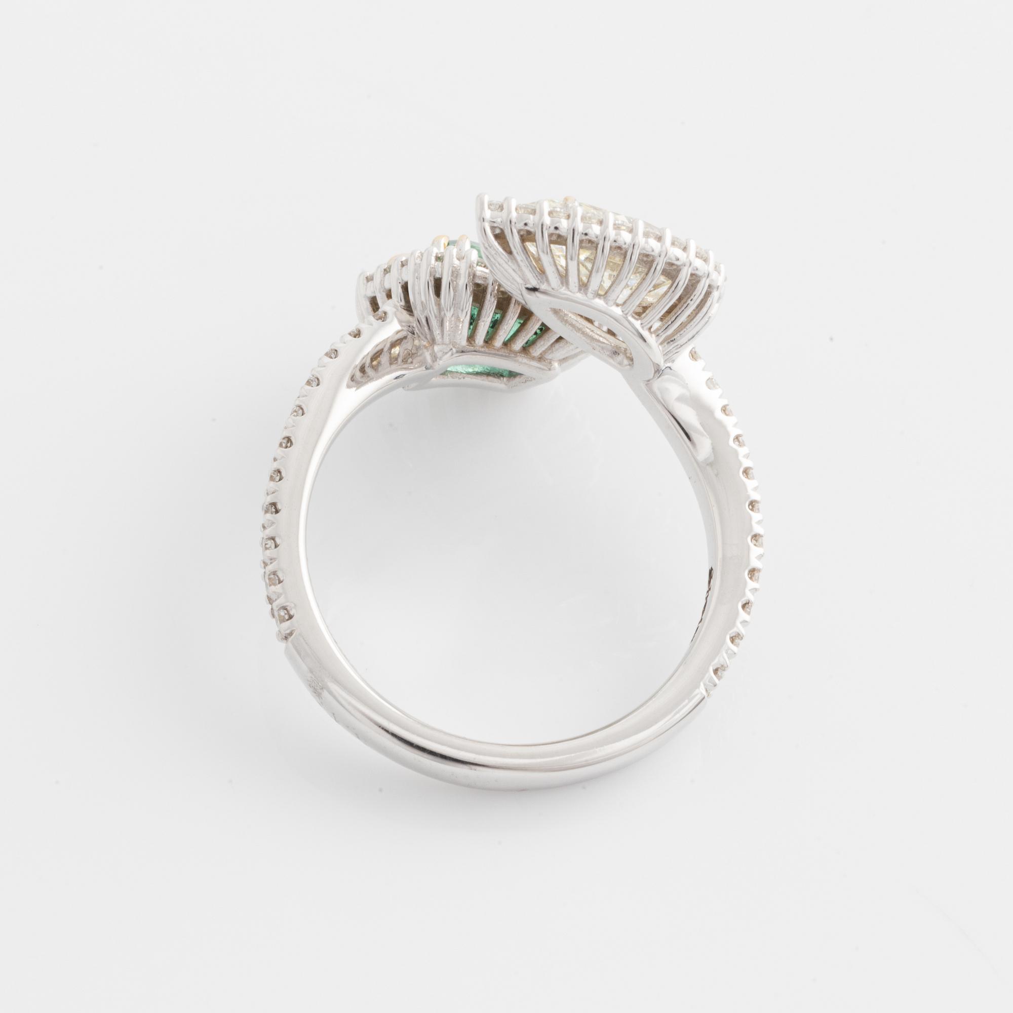 Ring with emerald-cut emerald and pear-shaped diamond, accompanying GIA diamond report.