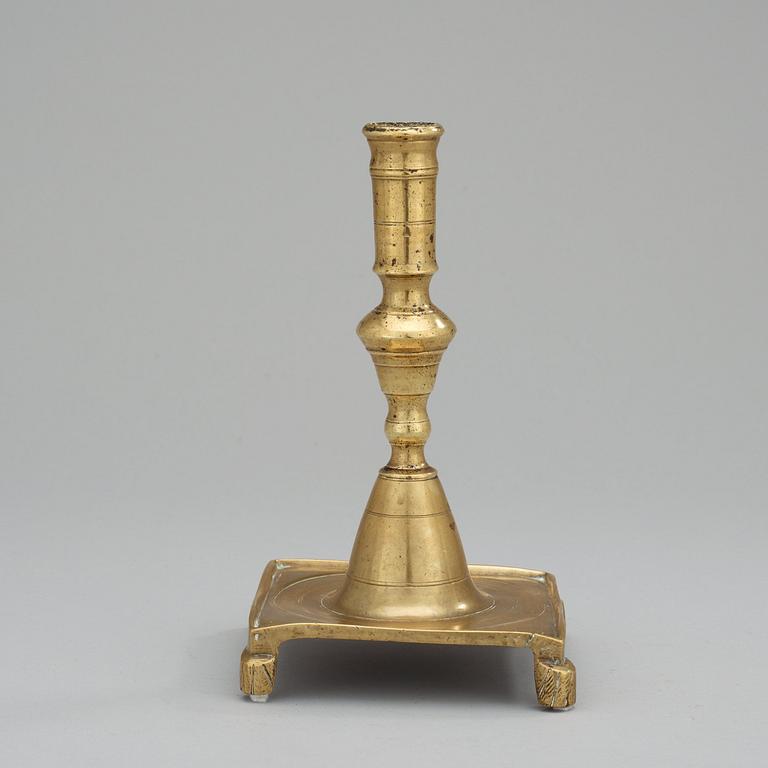 A Baroque 17/18th century brass candlestick.