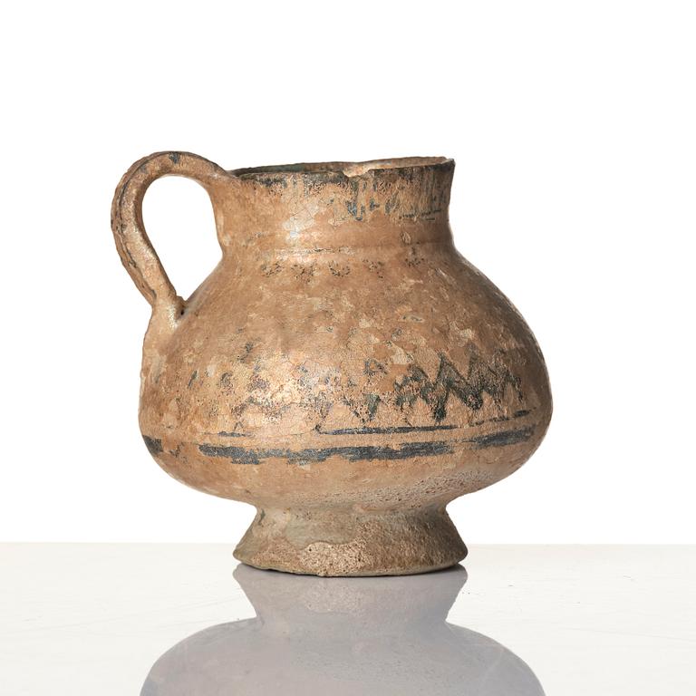 A central Asian pottery jug 12th-13th century.