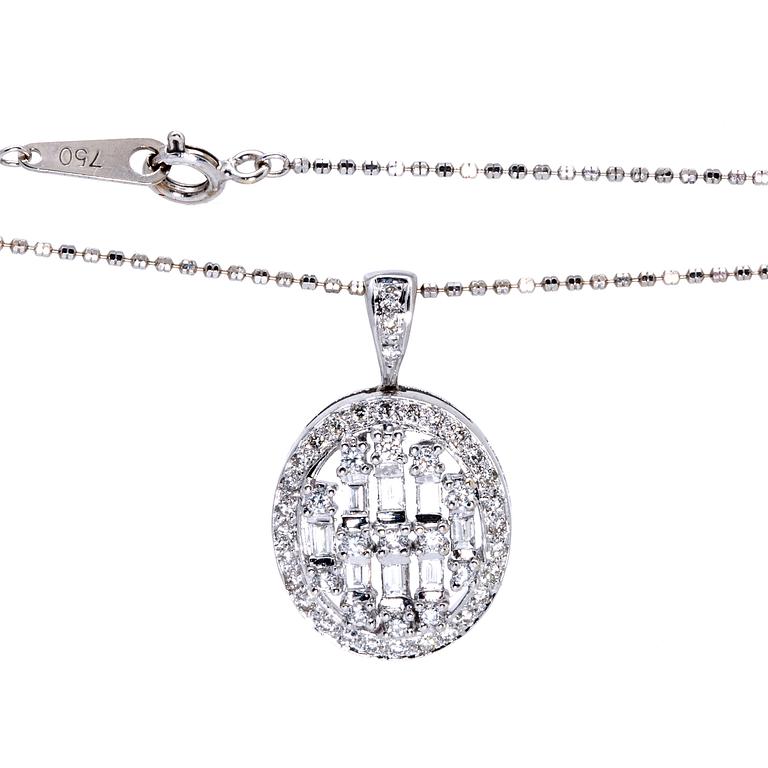 Pendant and chain, 18K whitegold, brilliant and baguette-cut diamonds approx 0,75 ct in total.