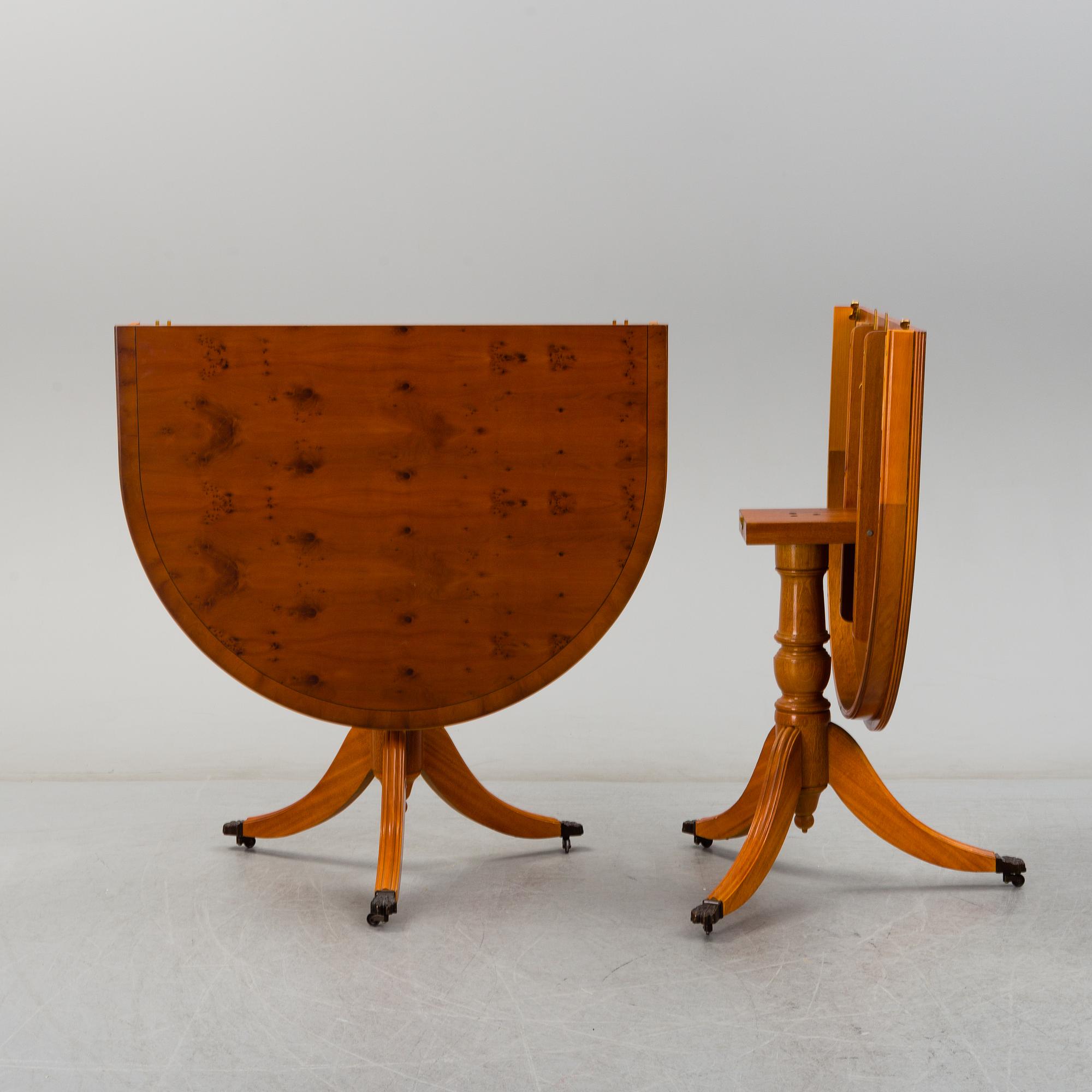 A late 20th century English style dining table and six chairs.