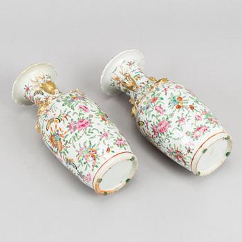 A pair of famille rose Canton vases, Qing dynasty, late 19th century.