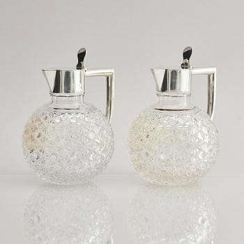 A Swedish pair of silver and cut-glass decanters, mark of C.G. Hallberg, Stockholm 1893.