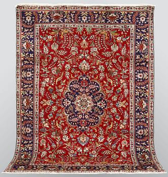 A carpet, Figural Tabriz, ca 310 x 220 cm.