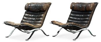 A pair of Arne Norell "Ari" black leather and steel easy chairs by Norell Möbel AB, probably 1960-70's.