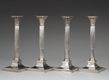 Two similar pairs of English candlesticks, marks of John Wakelin and William Taylor, London 1786 and 1787.