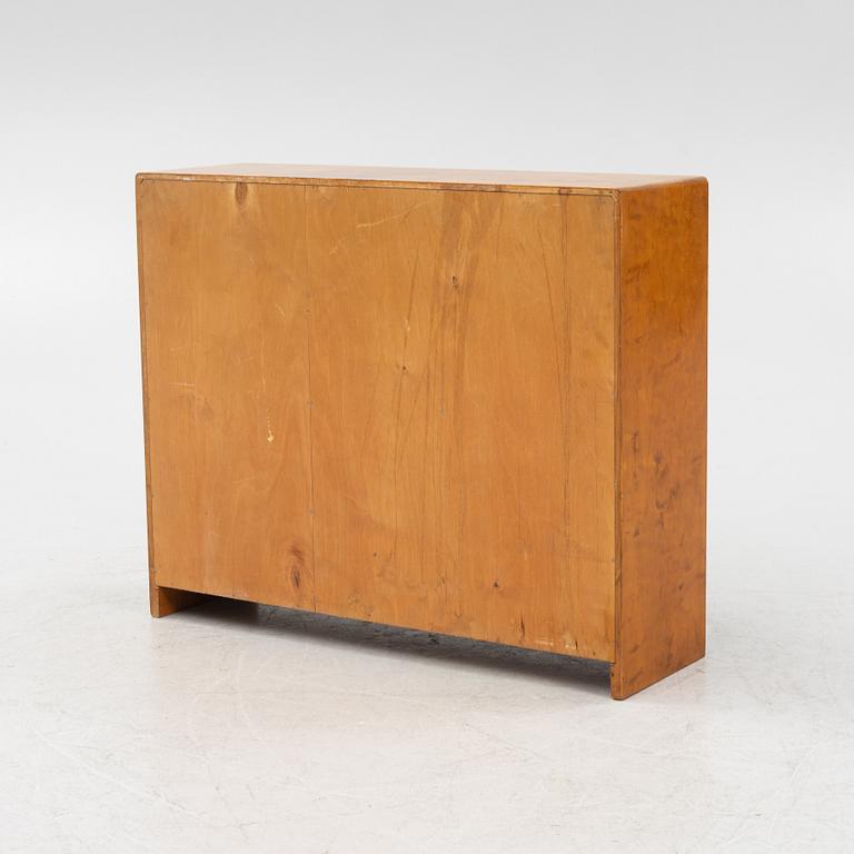 A birch wood book case with cabinet, 1930s.