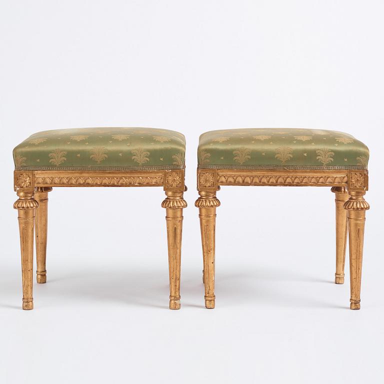 A pair of Gustavian giltwood stools by E. Ståhl (master in Stockholm 1794-1820).
