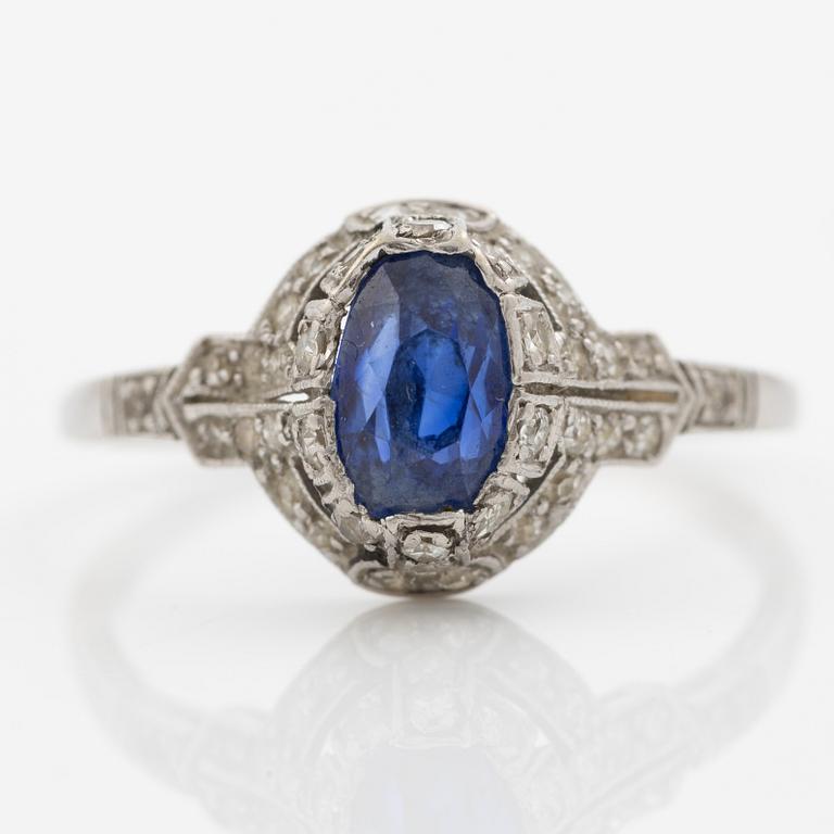 Ring 14K gold with a synthetic blue stone and small diamonds and white stones.