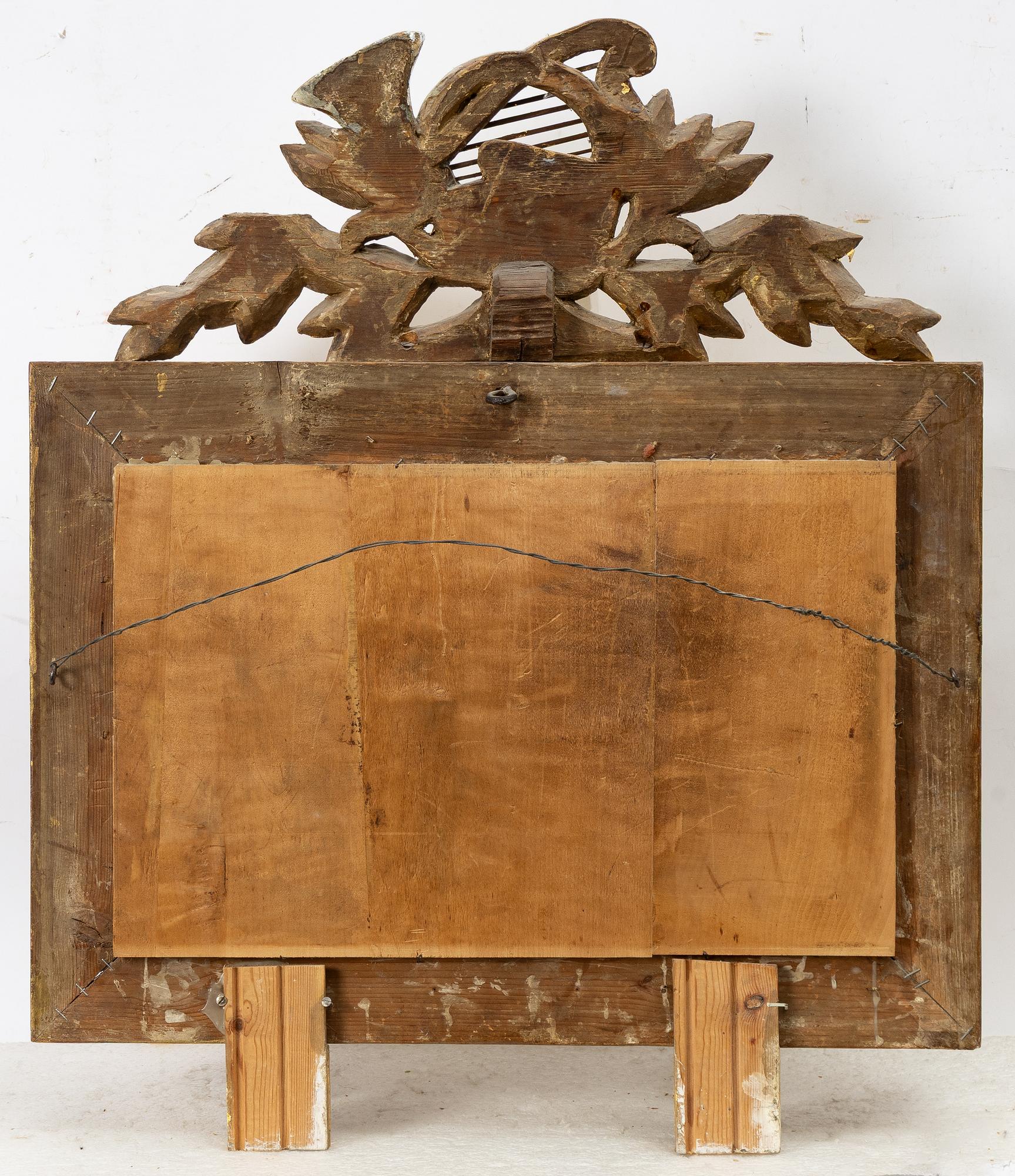 A gilt-gesso two-branch Empire girandole mirror, first part 19th century.