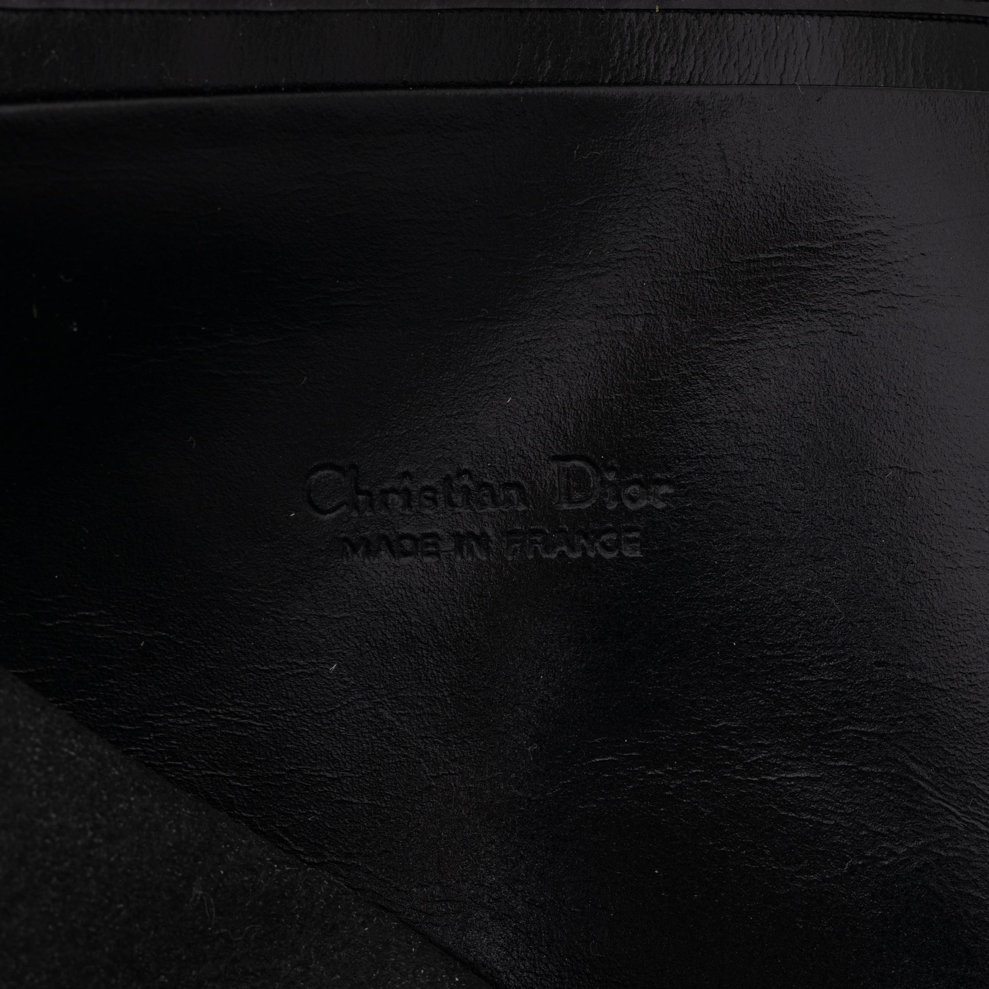 Christian Dior, a canvas clutch and wallet.