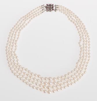 697. NECKLACE, 4-strands cultured pearls, 3,8-7,3 mm.