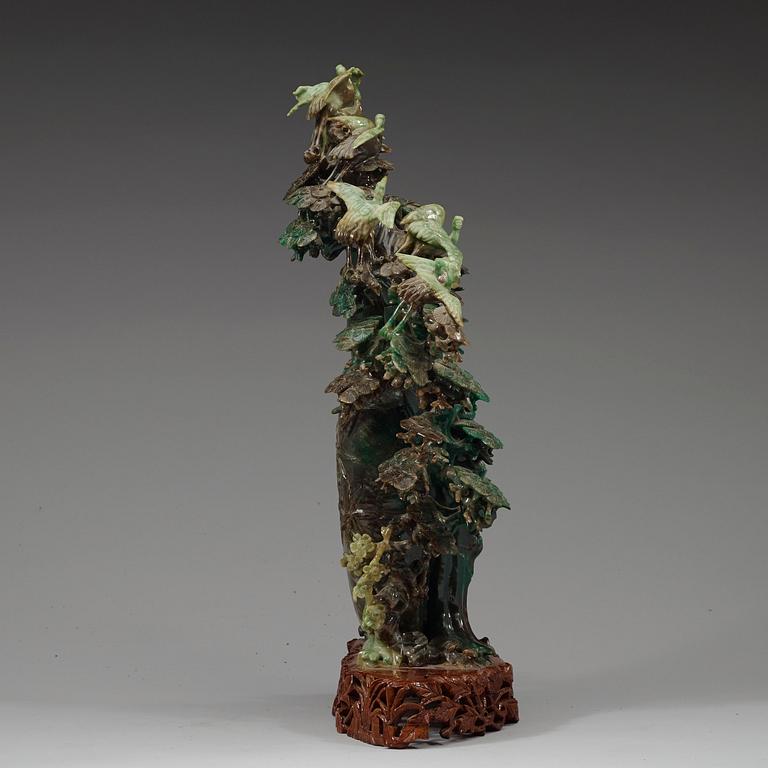 A large, Chinese carved jade pine tree with birds, 20th Century.