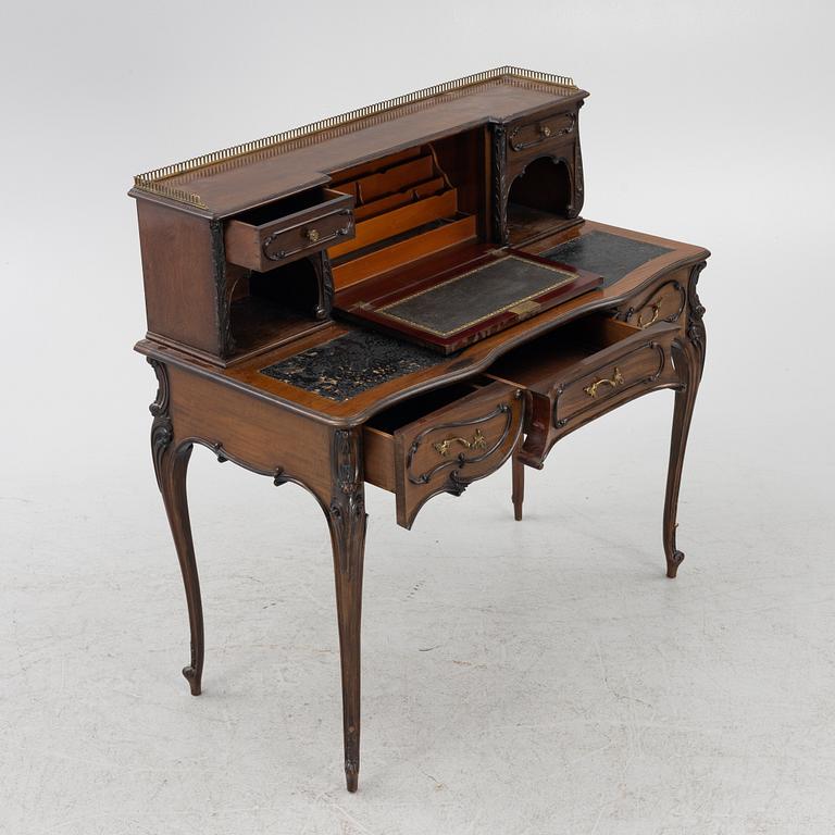 A mahogany veneered desk, mid 20th Century.