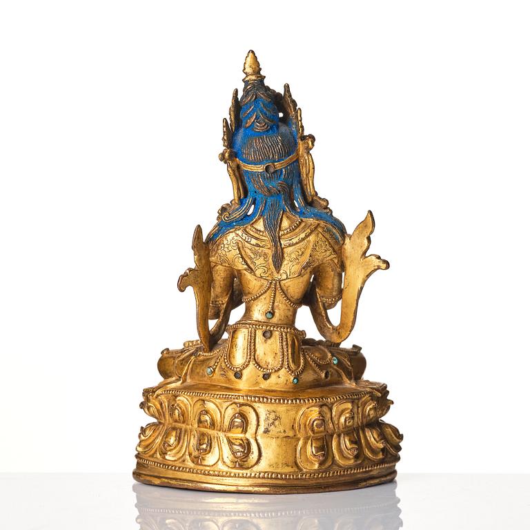 A gilt-bronze figure of Vajradhara
Tibet, circa 16th century.